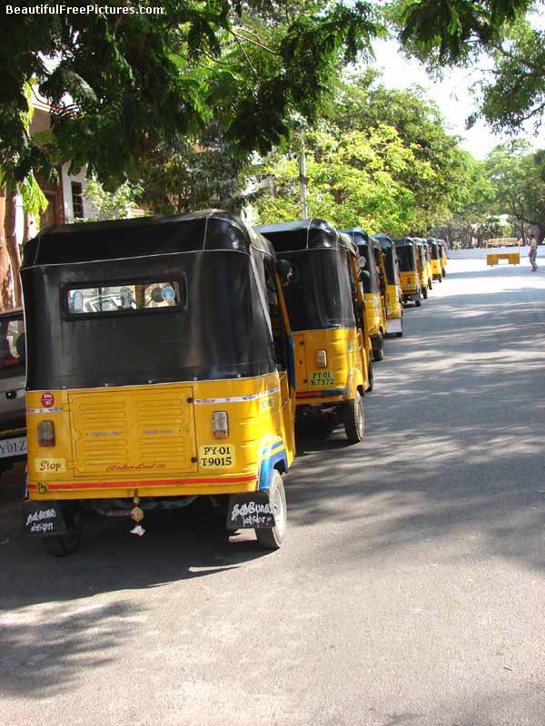 rickshaws standing in a queue