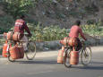 Picture of two delivery men of LPG cylinders